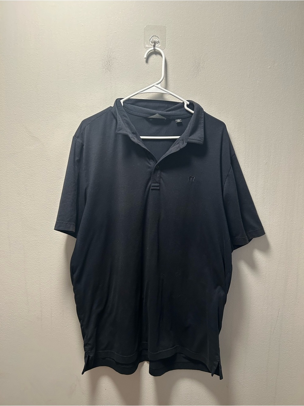 TravisMathew Black Polo with Subtle Logo